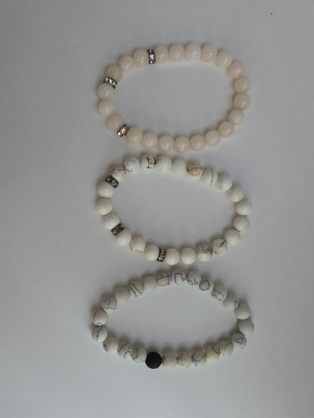 Two Howlite And One Quartz Beaded Stretch Bracelets